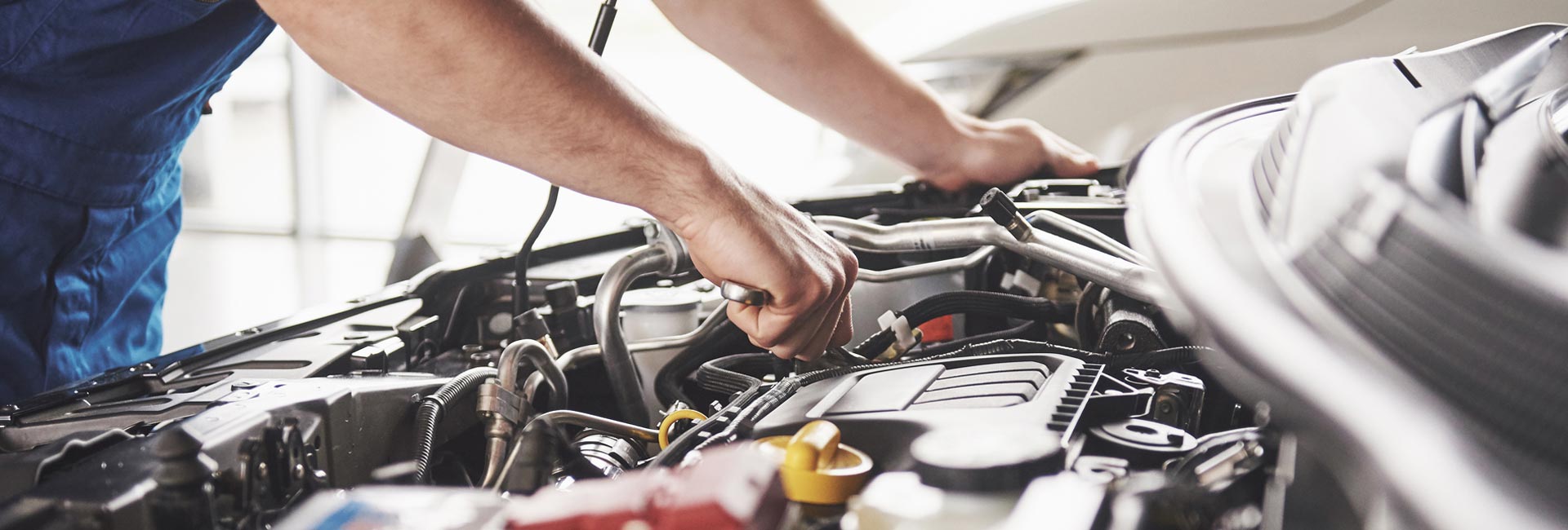 Auto Mechanic Working in Garage